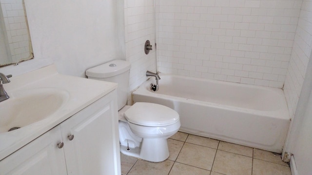 bathroom with toilet, vanity, washtub / shower combination, and tile patterned floors