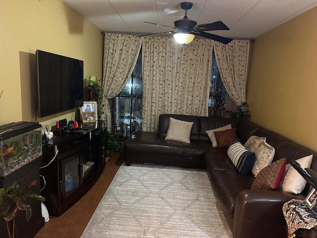 living room featuring tile patterned flooring and a ceiling fan