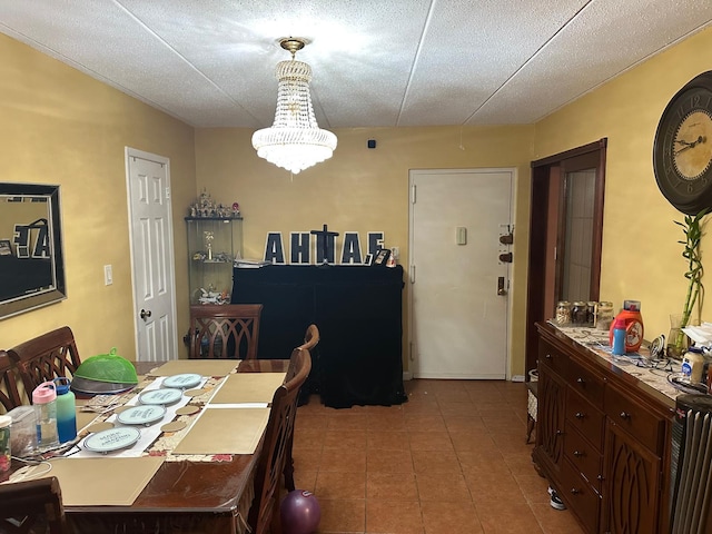 dining area featuring an inviting chandelier and tile patterned floors