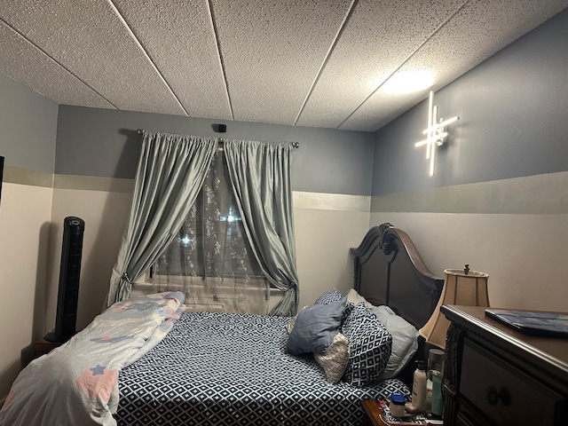 bedroom with a drop ceiling