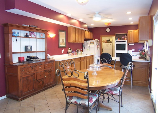 dining space with ceiling fan, light tile patterned flooring, and recessed lighting