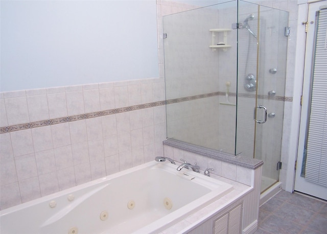 full bath featuring a whirlpool tub, tile patterned flooring, a shower stall, and visible vents