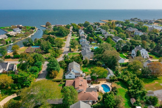 drone / aerial view with a residential view and a water view