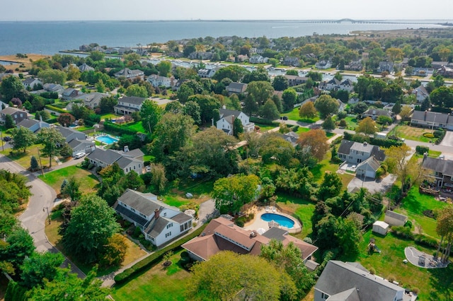 drone / aerial view with a water view and a residential view