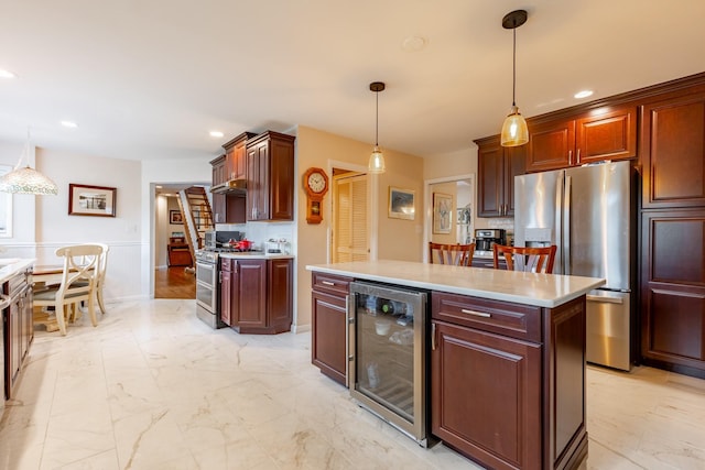 kitchen featuring wine cooler, appliances with stainless steel finishes, decorative light fixtures, marble finish floor, and light countertops