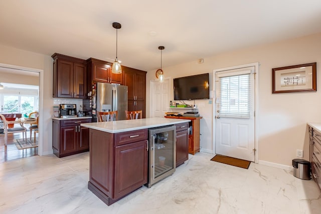 kitchen featuring decorative backsplash, wine cooler, marble finish floor, light countertops, and stainless steel refrigerator with ice dispenser