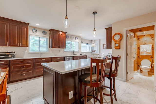 kitchen featuring dishwasher, marble finish floor, backsplash, and light countertops