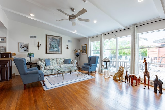 living room with lofted ceiling with beams, wood finished floors, visible vents, and recessed lighting