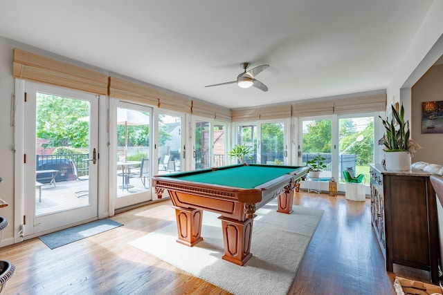 recreation room featuring pool table, light wood-type flooring, and a ceiling fan