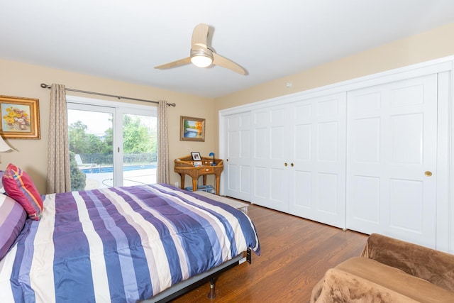 bedroom featuring wood finished floors, a ceiling fan, and access to exterior