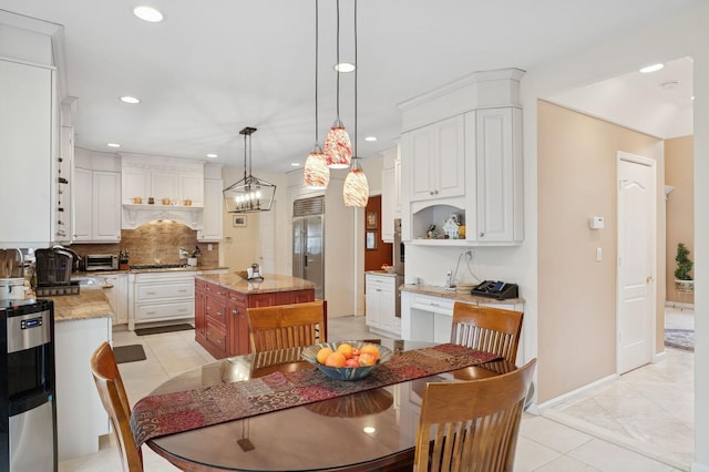 dining room with recessed lighting, baseboards, and light tile patterned floors