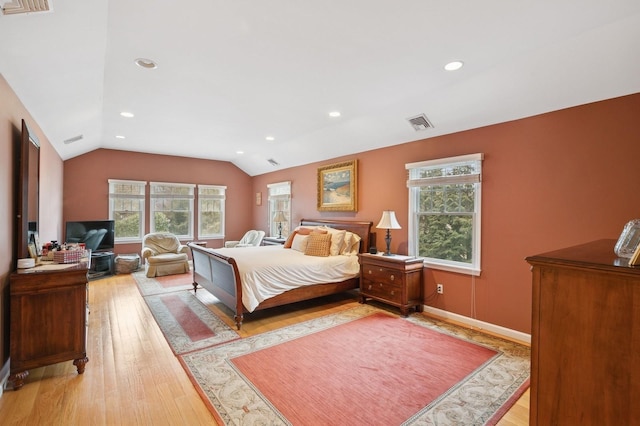 bedroom featuring vaulted ceiling, recessed lighting, visible vents, and light wood-style floors