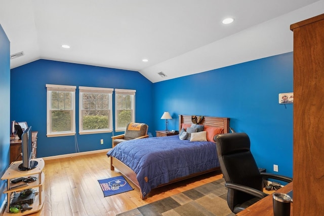 bedroom with lofted ceiling, recessed lighting, visible vents, baseboards, and hardwood / wood-style flooring