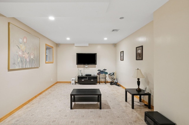 living room with baseboards, visible vents, and recessed lighting