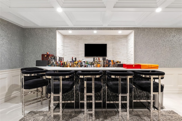 bar featuring recessed lighting, wainscoting, coffered ceiling, and wallpapered walls