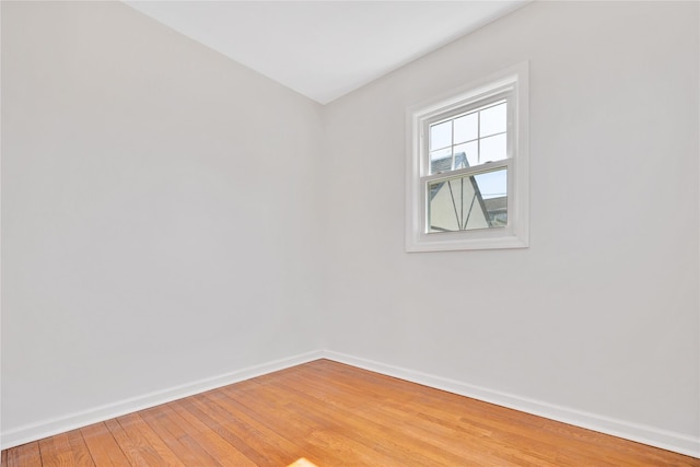 unfurnished room featuring light wood-style flooring and baseboards