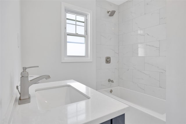 bathroom featuring bathtub / shower combination and a sink