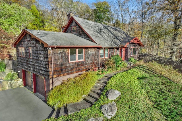 exterior space featuring an attached garage and driveway