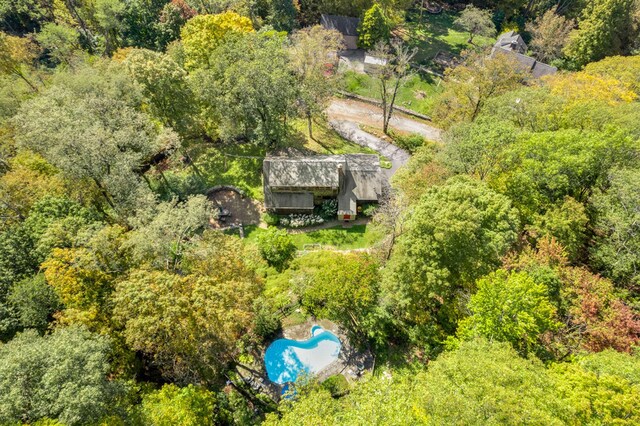 aerial view featuring a wooded view