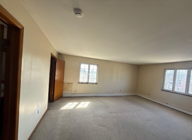 empty room with carpet flooring and baseboards