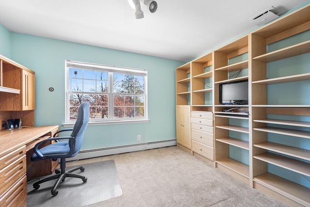 home office with a baseboard heating unit, light colored carpet, and visible vents