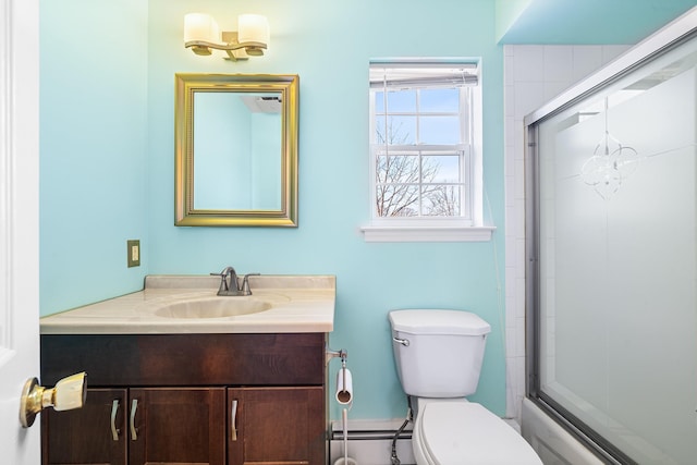 full bathroom featuring a baseboard radiator, vanity, and toilet