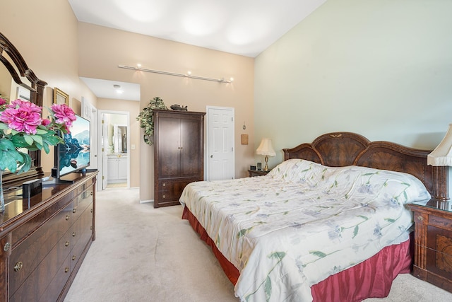 bedroom with light colored carpet