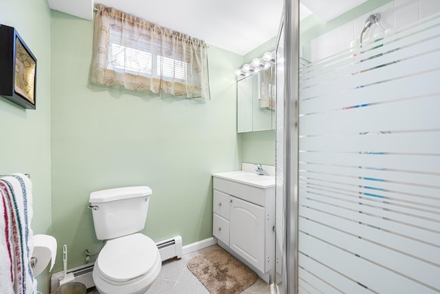 bathroom featuring tile patterned flooring, toilet, vanity, and baseboard heating