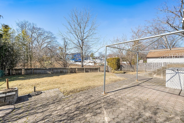 view of yard featuring a patio area and a fenced backyard