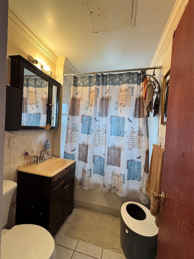 full bathroom with tile patterned floors, toilet, tile walls, and crown molding