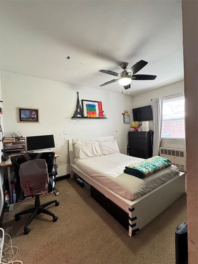 bedroom with carpet floors, a ceiling fan, and radiator heating unit