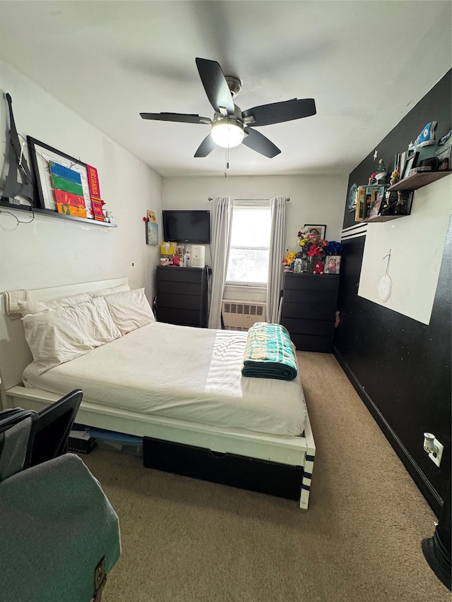 bedroom featuring cooling unit, a ceiling fan, and carpet floors