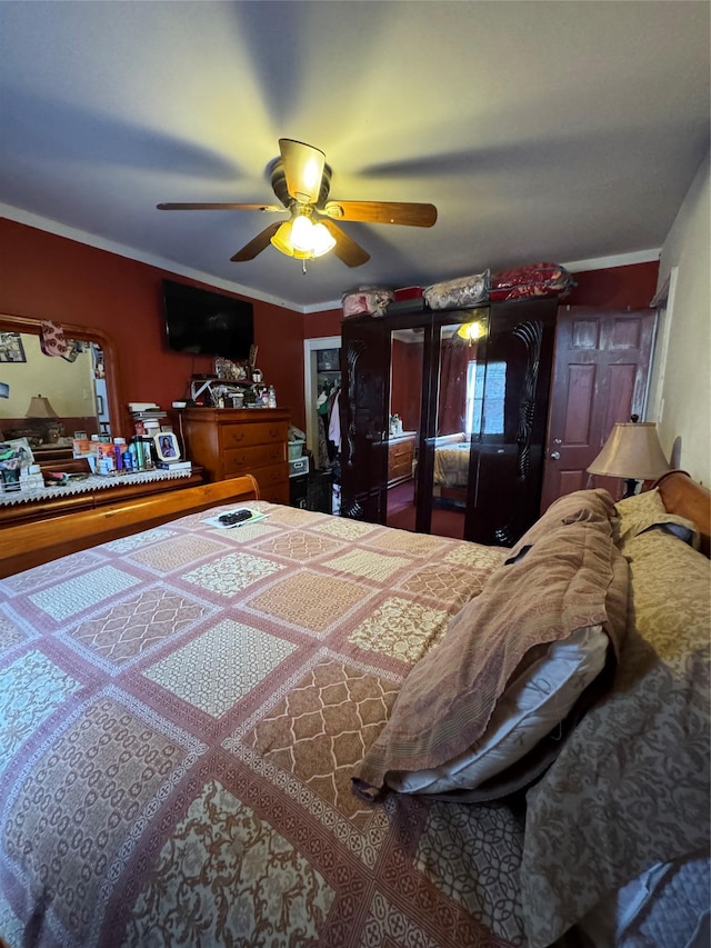 bedroom with crown molding and ceiling fan