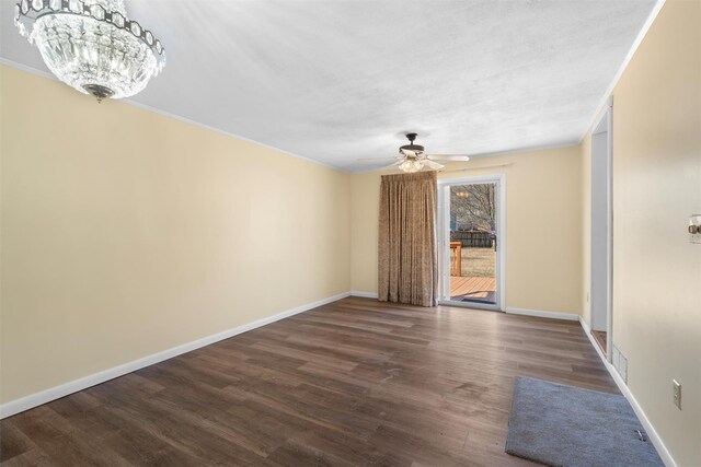 interior space featuring visible vents, baseboards, and dark wood finished floors