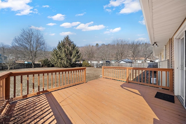 wooden terrace featuring a fenced backyard