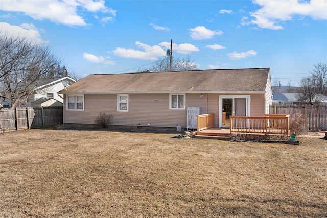 back of house featuring a yard, fence private yard, and a wooden deck