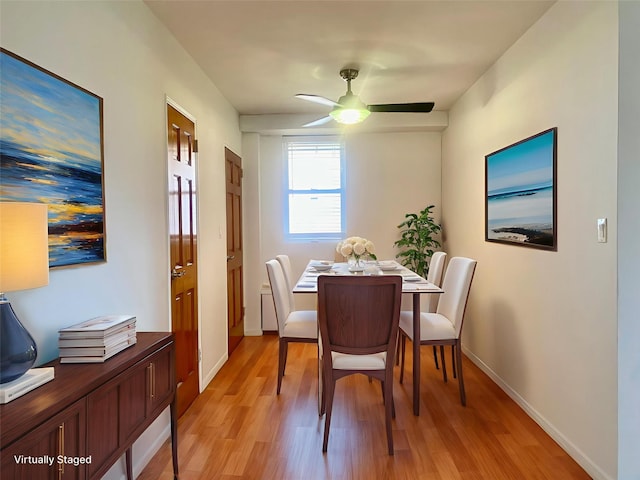 97-37 63rd Rd Unit 9H, Rego Park, NY 11374 - dining space with light wood-style floors and ceiling fan