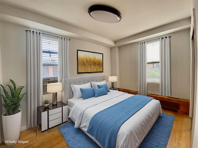 97-37 63rd Rd Unit 9H, Rego Park, NY 11374 - bedroom featuring multiple windows and light wood-type flooring