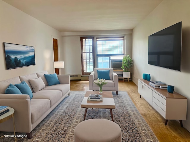 97-37 63rd Rd Unit 9H, Rego Park, NY 11374 - living room with light wood-style floors and a baseboard radiator