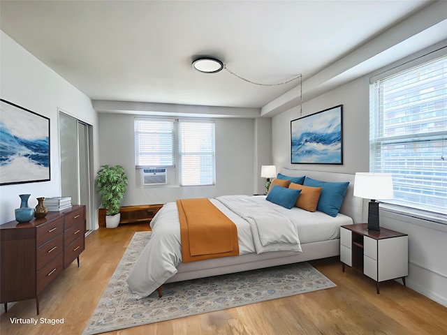 97-37 63rd Rd Unit 9H, Rego Park, NY 11374 - bedroom with cooling unit and light wood-type flooring