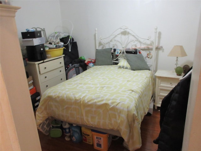 bedroom with wood finished floors