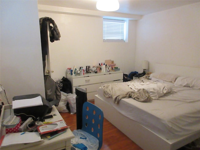 bedroom featuring wood finished floors