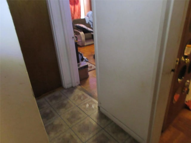 corridor featuring light tile patterned flooring