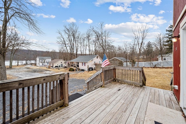 wooden deck with fence and an outdoor structure