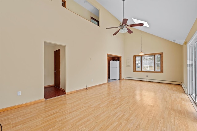 unfurnished living room with light wood-type flooring, a baseboard radiator, and ceiling fan