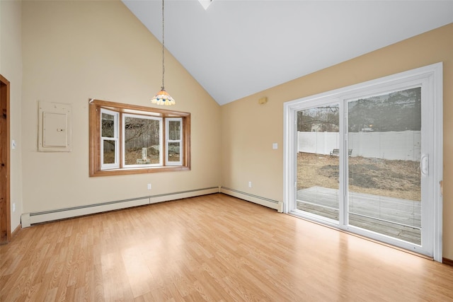 spare room featuring light wood-type flooring, electric panel, high vaulted ceiling, and baseboard heating