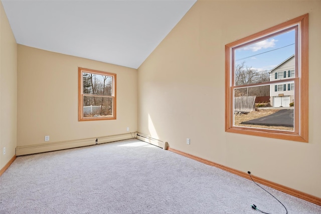 unfurnished room featuring baseboards, a baseboard heating unit, vaulted ceiling, and carpet flooring