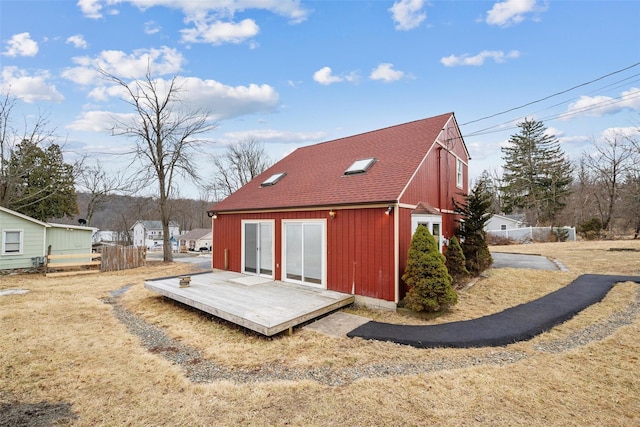 exterior space featuring an outbuilding and fence