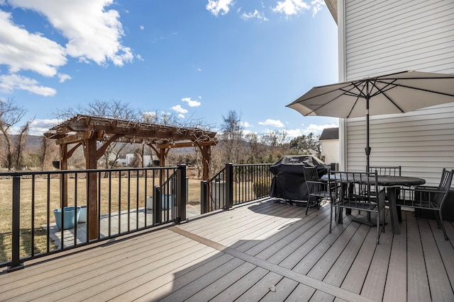 wooden terrace featuring area for grilling, a pergola, and outdoor dining area