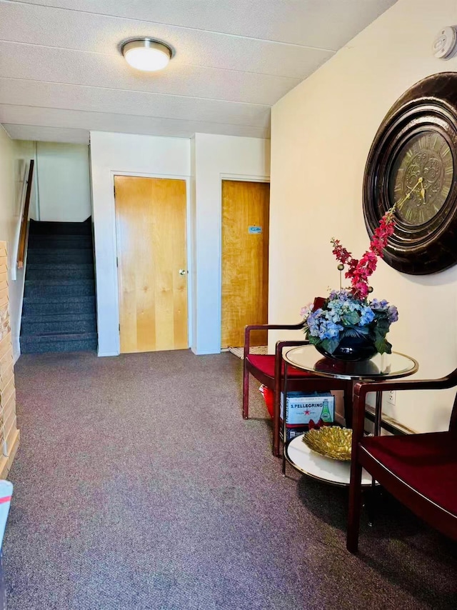 interior space featuring carpet and stairway